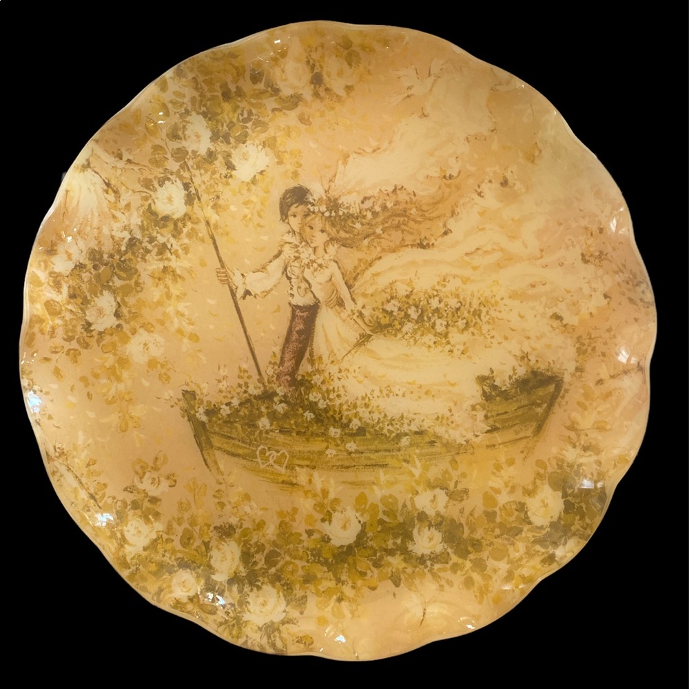 1970s FAB tray featuring an illustration of a flower child couple on a rowboat.